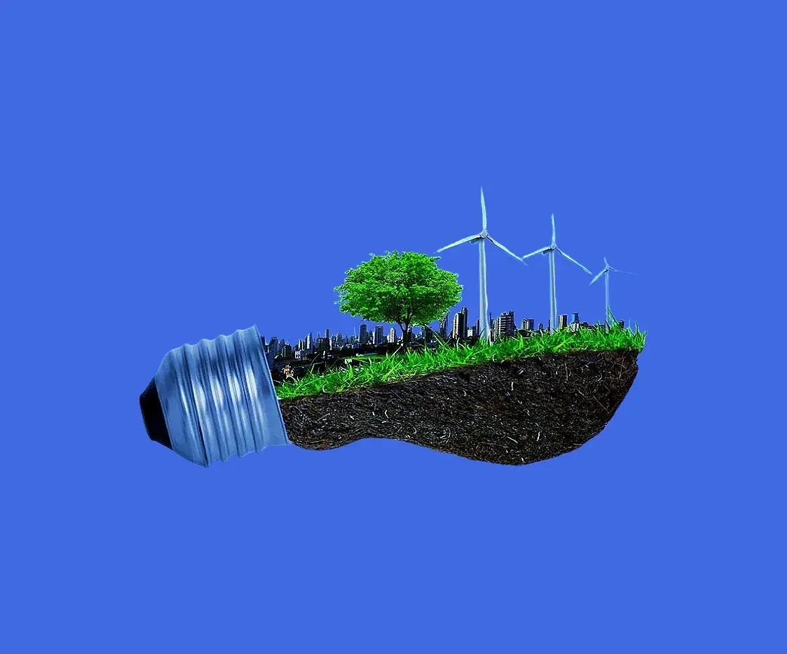 Light bulb with grass and windmills 